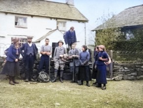 Colourised image of men and women in mountaineering mountain climbing group standing in fron of