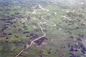 Captioned as 'aerial photo Saigon', meandering river in flat agricultural landscape of paddy