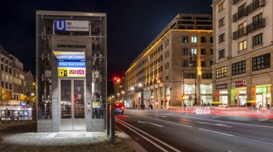 Night photo, long exposure with motion blur, modern lift at Unter den Linden underground station,