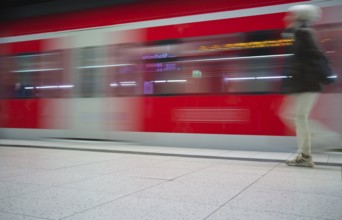 Underground arriving S-Bahn, train, class 420 in traffic red, platform, stop, Stadtmitte station,