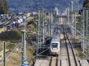 A8 motorway with traffic jam. The new high-speed railway line of Deutsche Bahn AG runs parallel