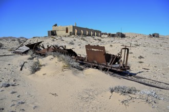 Wagon of an old narrow-gauge railway in the desert sand, Pomona, restricted diamond area, near