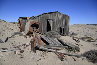 Dilapidated building in the desert sand, Pomona, restricted diamond area, near Lüderitz, Karas