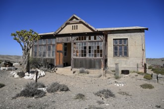 Dilapidated building in the desert sand, Pomona, restricted diamond area, near Lüderitz, Karas