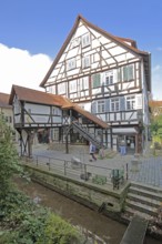 Historic nun's house built in 1488 with staircase by the stream, Ammer Canal, half-timbered house,