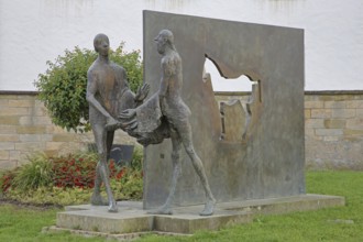 Sculpture Martin of Tours by Karl Ulrich Nuss, Saint Martin sharing his cloak with a beggar, symbol