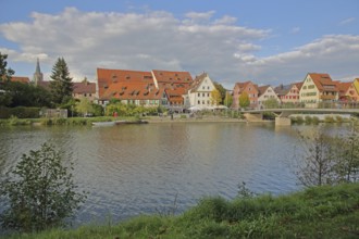 Half-timbered houses, town mill, tithe barn on the banks of the Neckar, pedestrians, boats,