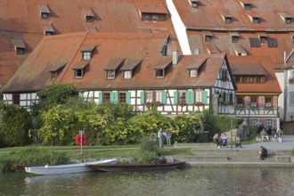 Half-timbered houses, town mill, tithe barn on the banks of the Neckar, pedestrians, boats,