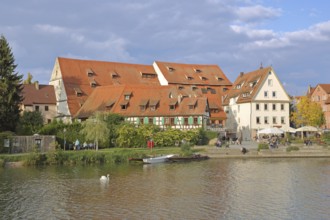 Half-timbered houses, town mill, tithe barn on the banks of the Neckar, pedestrians, boats,