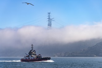 Coastguard boat on the Bosporus in the fog near Istanbul, Turkey