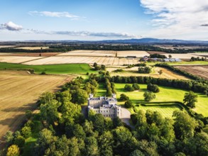 Wedderburn Castle and Barns over fields from a drone, Duns, Berwickshire, Scotland, UK