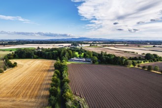Sunset of Fields over Wedderburn Castle and Barns from a drone, Duns, Berwickshire, Scotland, UK