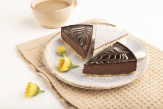 Chocolate and Vanilla Cake pops Marshmallow with cup of coffee on white wooden background and beige