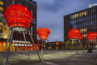 Illuminated sculptures of Dortmund roses in front of Dortmund's landmark U, Centre for Art and