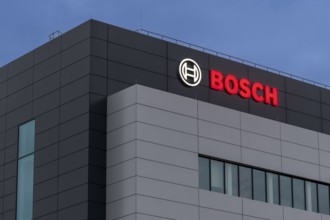 Bosch logo on grey building façade at dusk, Waiblingen, Baden-Württemberg, Germany