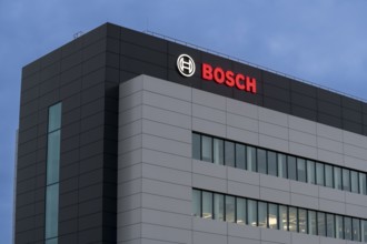 Building with Bosch logo in the evening sky, grey-blue architecture with windows, Waiblingen,