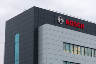 Grey-blue building with Bosch logo and large windows in modern architecture, Waiblingen,
