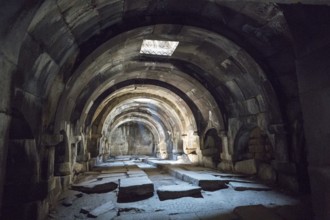 Arched, stone interior structure emphasised by light and shadow, Orbelian's Caravanserai, Selim