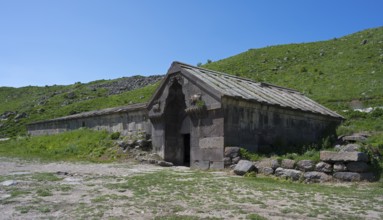Historic building surrounded by green landscape under a clear sky, Orbelian's Caravanserai, Selim