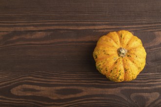 Orange Pumpkin on brown wooden background. Top view, copy space, flat lay. healthy food, vegetable,