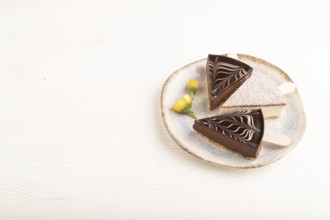 Chocolate and Vanilla Cake pops Marshmallow on white wooden background. side view, copy space