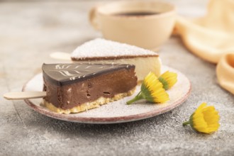 Chocolate and Vanilla Cake pops Marshmallow with cup of coffee on brown concrete background and