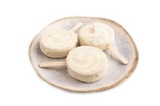 ?hocolate Ice cream in white glaze isolated on white background, side view, close up, minimalism