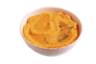 Sweet potato porridge in ceramic bowl isolated on white background. Diet, healthy eating concept.