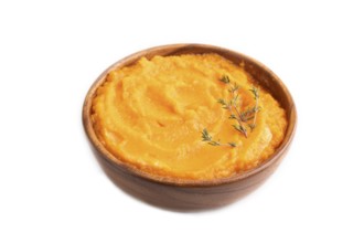 Sweet potato porridge in wooden bowl isolated on white background. Diet, healthy eating concept.