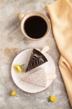 Chocolate and Vanilla Cake pops Marshmallow with cup of coffee on brown concrete background and