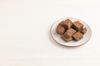 Chocolate marshmallow on white wooden background. side view, copy space