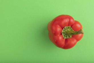 Red pepper on green pastel background. Top view, flat lay, copy space. healthy food, vegetable,