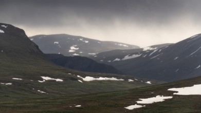 Lonely plateau with snowfields, low clouds, Kongevegen or King's Road, Olavsleden pilgrimage route,