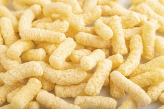 Corn flakes sticks with caramel isolated on white background. top view, flat lay, close up