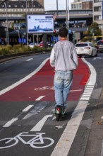 E-scooter on cycle path, cycle lane, marked in red to draw the attention of motorists to the cycle
