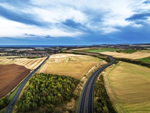 Sunset of Fields and Farms over Traprain Law and Hailes Castle from a drone, River Tyne,