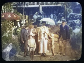 Family group standing in pleasure gardens at Karsino of Fred Karno, Tagg's Island, Molesley,