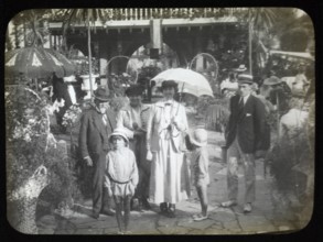 Family group standing in pleasure gardens at Karsino of Fred Karno, Tagg's Island, Molesley,