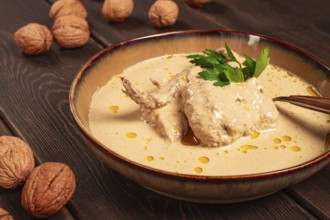 Satsivi, Georgian dish, chicken in nut sauce, cold appetizer, rustic, no people, homemade