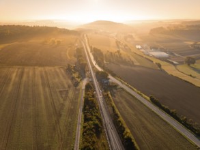 View of a railway network, fields and roads at dawn, Hermann Hesse Railway, Ostelsheim, Black