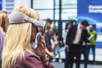 Mercedes exhibition stand. The Virtual Ride. Trade fair visitor with 3D glasses. IAA MOBILITY in