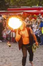 A fire artist spits impressive flames in front of a tense audience, Feuernacht, Sindelfingen,
