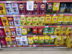 Various tea brands displayed in colourful packaging on a supermarket shelf, tea for sale, Turkey