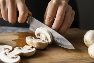 Close up of button mushrooms being sliced on a cutting board, AI generated