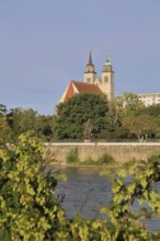 Late Romanesque St John's Church with twin towers and Elbe, Elbe riverbank, Magdeburg,