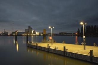 View of a mooring pontoon on the Weser at Lankenauer Höf in the background an industrial area in