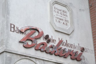 Façade lettering of an old bakery that was applied over even older lettering, Barrien, Syke,