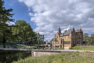 1824 iron suspension bridge in park of the Wissekerke Castle, Kasteel van Wissenkerke in the