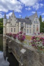 Kasteel Cortewalle, 15th century moated castle in Flemish Renaissance style at Beveren in summer,