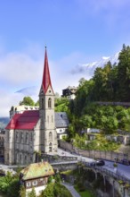 Parish church on the waterfall path in Bad Gastein, in the background the snow-covered peaks of the